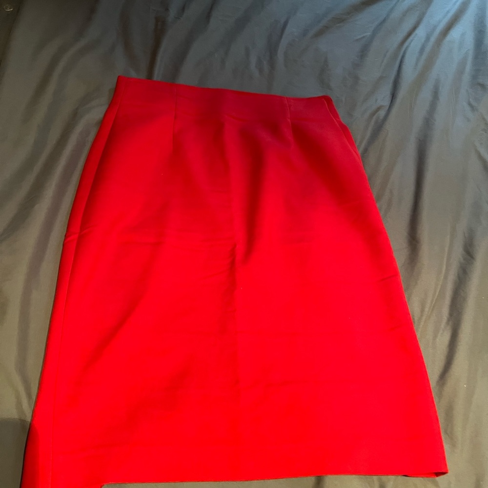 Red mid length skirt.